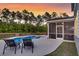 Backyard features a private pool with patio and screened-in porch with comfortable seating at 214 Squire Pope Rd, Summerville, SC 29486