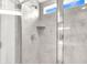 Tiled shower with glass door and window at 214 Squire Pope Rd, Summerville, SC 29486