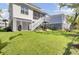 Spacious backyard featuring a well-kept lawn, garden, black fencing, and lush foliage at 2194 Cultura Cir, Mount Pleasant, SC 29466