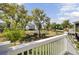Scenic backyard view from the deck, overlooking lush landscaping and neighboring homes at 2194 Cultura Cir, Mount Pleasant, SC 29466