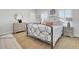 Serene bedroom with a wrought iron bed frame, dresser, and side tables, creating a relaxing retreat at 2194 Cultura Cir, Mount Pleasant, SC 29466