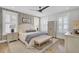 Well-lit bedroom featuring neutral decor, a ceiling fan, and an upholstered bench at 2194 Cultura Cir, Mount Pleasant, SC 29466