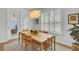 Dining area with seating for six, large windows with wood shutters, and stylish lighting at 2194 Cultura Cir, Mount Pleasant, SC 29466