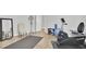 Spacious exercise room with yoga mat, recumbent bike, and other home gym equipment at 2194 Cultura Cir, Mount Pleasant, SC 29466