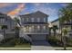 Stunning two-story coastal home with a spacious front porch, well-manicured lawn, and ample parking at 2194 Cultura Cir, Mount Pleasant, SC 29466