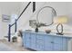 Inviting foyer with a statement mirror, decorative console table, and staircase leading to the upper level at 2194 Cultura Cir, Mount Pleasant, SC 29466