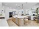 Open-concept kitchen with an island, stainless steel appliances, and views to the living room at 2194 Cultura Cir, Mount Pleasant, SC 29466