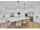 Modern kitchen features a large center island with seating, stainless steel appliances, and stylish pendant lighting at 2194 Cultura Cir, Mount Pleasant, SC 29466