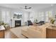 Cozy living room featuring a fireplace, elegant shutters, and comfortable seating, perfect for relaxation at 2194 Cultura Cir, Mount Pleasant, SC 29466