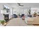 Bright and airy living room boasts a fireplace, plantation shutters, and comfortable seating for relaxing at 2194 Cultura Cir, Mount Pleasant, SC 29466
