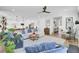 Spacious living area showcasing comfortable furnishings, a fireplace, and an open layout flowing into the kitchen at 2194 Cultura Cir, Mount Pleasant, SC 29466