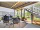 Relaxing covered patio area with outdoor seating and grill, perfect for enjoying the backyard view at 2194 Cultura Cir, Mount Pleasant, SC 29466