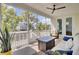 Scenic screened porch with comfortable seating, ceiling fan, and outdoor views at 2194 Cultura Cir, Mount Pleasant, SC 29466