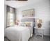 Inviting bedroom with shiplap wall, neutral decor, and soft natural light at 224 Callibluff Dr, Summerville, SC 29486