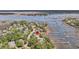 Aerial view featuring waterfront property with docks, complemented by lush green surroundings and serene waters at 2254 Beckenham Dr, Mount Pleasant, SC 29466