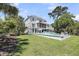 Expansive backyard showcasing a pool, lush green lawn, and a well-maintained home exterior at 2254 Beckenham Dr, Mount Pleasant, SC 29466