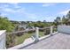 Balcony area with outdoor pool, green grass, trees, lake, and blue sky at 2254 Beckenham Dr, Mount Pleasant, SC 29466