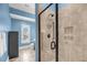 Bright bathroom featuring a glass-enclosed shower, blue walls, and tiled flooring at 2254 Beckenham Dr, Mount Pleasant, SC 29466