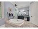 Elegant bathroom featuring a corner soaking tub, vanity, and tiled floors at 2254 Beckenham Dr, Mount Pleasant, SC 29466