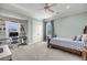 A secondary bedroom with built-in shelving, a desk, and an inviting bed. The room features neutral paint and carpet at 2254 Beckenham Dr, Mount Pleasant, SC 29466