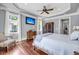 Bright bedroom with hardwood floors, natural light, and a wall-mounted television at 2254 Beckenham Dr, Mount Pleasant, SC 29466