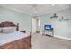 Comfortable secondary bedroom features neutral walls, carpet, and trim, with a ceiling fan and a television at 2254 Beckenham Dr, Mount Pleasant, SC 29466