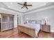 Elegant bedroom with a ceiling fan, hardwood floors and stylish furnishings at 2254 Beckenham Dr, Mount Pleasant, SC 29466