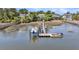 Boats parked at a private dock on the water with neighborhood homes in the background at 2254 Beckenham Dr, Mount Pleasant, SC 29466