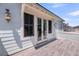 This deck features stylish light fixtures, access to the interior, and offers the perfect place for outdoor relaxation at 2254 Beckenham Dr, Mount Pleasant, SC 29466