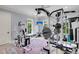 Full gym with lots of equipment, natural light and pink rug at 2254 Beckenham Dr, Mount Pleasant, SC 29466