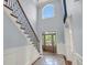 Grand foyer with a staircase, high ceilings, and a large arched window at 2254 Beckenham Dr, Mount Pleasant, SC 29466