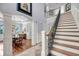Spacious foyer with hardwood floors, staircase, and an archway into the dining room at 2254 Beckenham Dr, Mount Pleasant, SC 29466