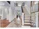 Grand two-story foyer with tiled flooring, staircase, and view into the living room at 2254 Beckenham Dr, Mount Pleasant, SC 29466