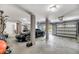 Spacious garage with gray pillars, a black car parked inside, and two garage doors providing ample parking space at 2254 Beckenham Dr, Mount Pleasant, SC 29466