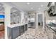 Kitchen boasts a spacious island, stainless steel appliances, and brick flooring at 2254 Beckenham Dr, Mount Pleasant, SC 29466