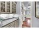 Charming kitchenette with granite countertops, stylish cabinets, and an adjacent breakfast bar with seating at 2254 Beckenham Dr, Mount Pleasant, SC 29466