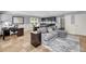 Spacious living room featuring a sectional sofa, desk, and wet bar area at 2254 Beckenham Dr, Mount Pleasant, SC 29466
