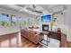 Expansive living room featuring a fireplace, coffered ceilings, a ceiling fan, and large windows at 2254 Beckenham Dr, Mount Pleasant, SC 29466