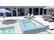 A luxurious backyard featuring a clear pool, an inviting hot tub, and stylish lounge chairs, perfect for relaxation at 2254 Beckenham Dr, Mount Pleasant, SC 29466