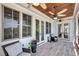 Relaxing screened porch with wood ceiling, ceiling fans, and comfortable seating at 2254 Beckenham Dr, Mount Pleasant, SC 29466