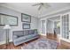 Sitting room area with hardwood floors, wall art, sofa, and open door to a hallway at 2254 Beckenham Dr, Mount Pleasant, SC 29466