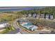 Aerial view of the community pool with lush landscaping, clubhouse, and surrounding homes at 2636 Colonel Harrison Dr, Johns Island, SC 29455