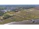 Expansive aerial view of a waterfront community showcasing marshland, waterways, and scenic boardwalks at 2636 Colonel Harrison Dr, Johns Island, SC 29455