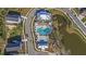 Aerial view of a community pool and clubhouse surrounded by lush landscaping at 2636 Colonel Harrison Dr, Johns Island, SC 29455