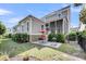 Exterior view of a well-maintained home with outdoor seating, a grill, and lush landscaping, offering a private retreat at 2636 Colonel Harrison Dr, Johns Island, SC 29455