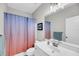 Bathroom featuring a white vanity, large mirror, and a colorful shower curtain at 2636 Colonel Harrison Dr, Johns Island, SC 29455
