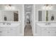 Bright bathroom features dual sinks, elegant mirrors, with doorway view into main bedroom, and a modern shower at 2636 Colonel Harrison Dr, Johns Island, SC 29455