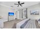 Bright bedroom featuring plush carpet, TV with scenic view, natural lighting and neutral walls, creating a relaxing atmosphere at 2636 Colonel Harrison Dr, Johns Island, SC 29455