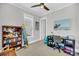 bedroom featuring, a ceiling fan, window, carpet, neutral walls, a desk and a bookshelf filled with toys at 2636 Colonel Harrison Dr, Johns Island, SC 29455