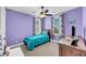 Cozy bedroom with colorful curtains, purple walls, carpeted floor, and a ceiling fan at 2636 Colonel Harrison Dr, Johns Island, SC 29455